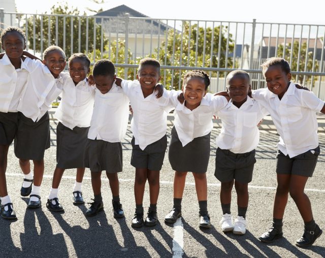 Elementary school kids in Africa posing in school playground