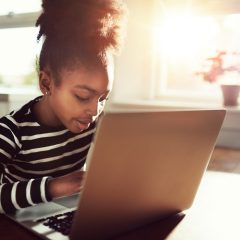 Young African girl amusing herself at home